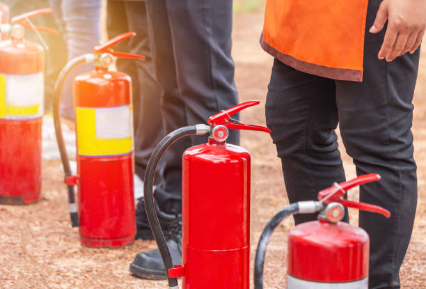 Row of fire extinguisher during training basic fire fighting for volunteers